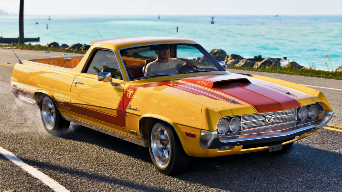 Yellow Ganado Retro Build pickup with red stripes beside the sea